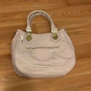 This is a light lavender semi oval strap bag